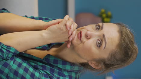 Vertical-video-of-Home-office-worker-woman-despairing.